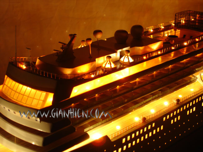Model Cruise Ship Asuka II with lights at night from deck view