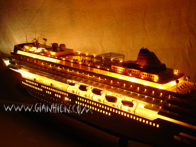 Model Cruise Ship Asuka II with lights at night from stern view