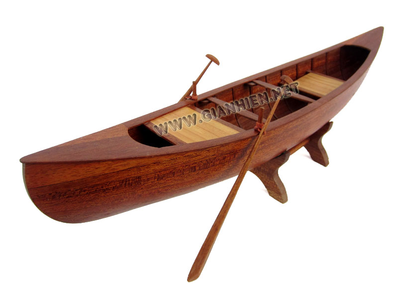 Wooden rowing canoe